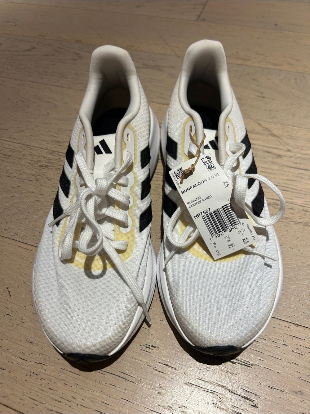 adidas White Sneakers with Black Stripes and Pale Yellow Accents